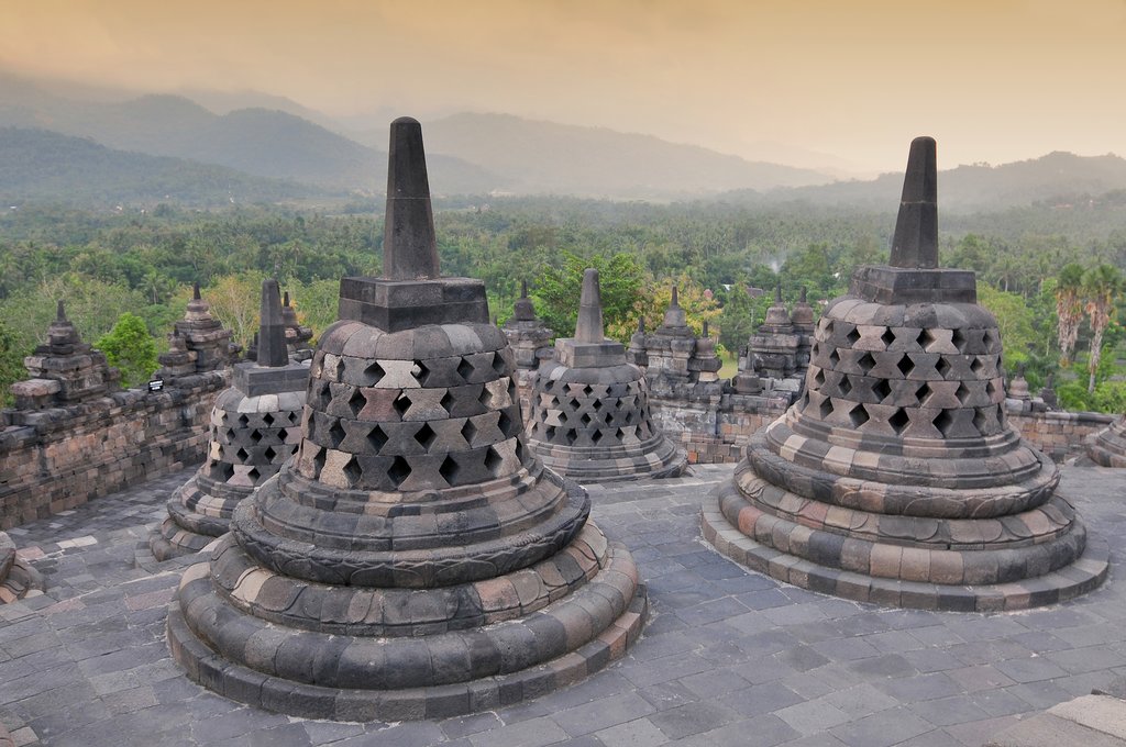 Visit the iconic stupas in Borobudur Temple