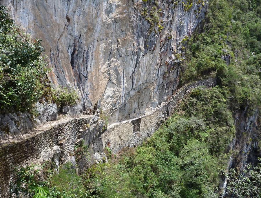 Walk on the stone walkway of the Inca Trail on the way to the ruins of Puerta del Sol