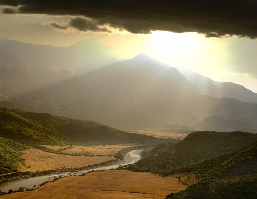 A dramatic sky illuminates the Vjosa River