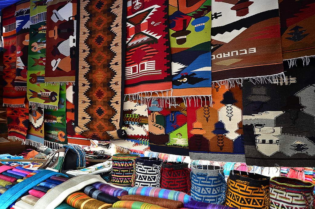 Textiles in a market booth in Otavalo