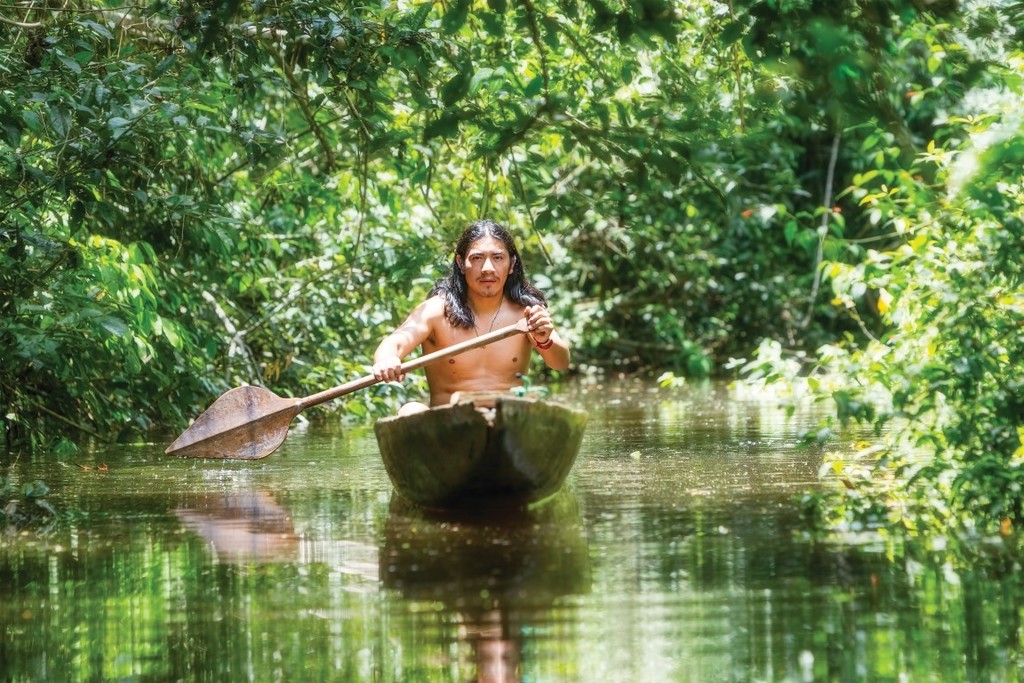 Local rowing a traditional canoe
