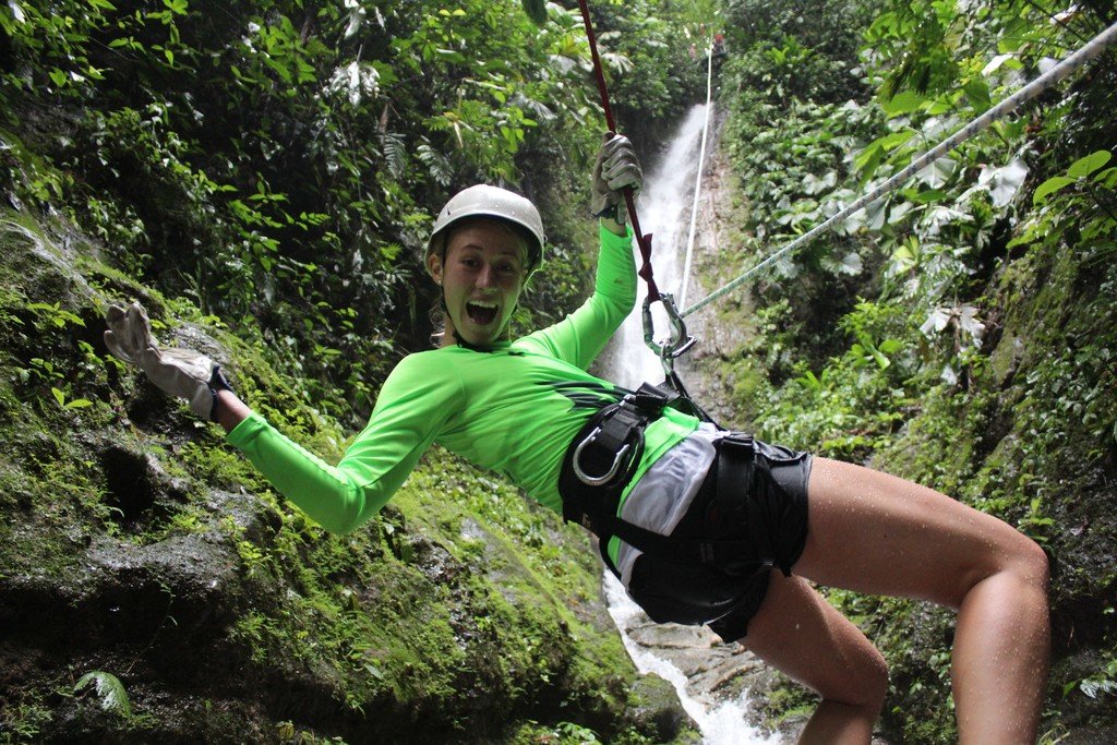 Rappelling down a waterfall