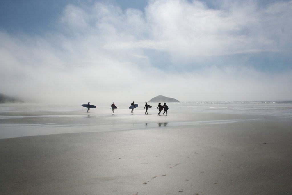 Early morning surfers out to catch waves in Tofino