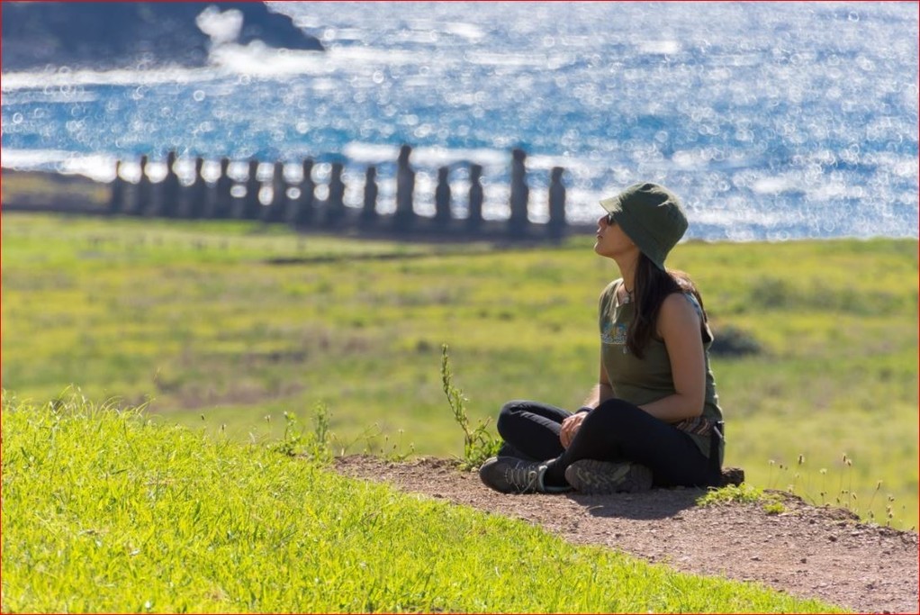 A traveler basks in the sun on Easter Island
