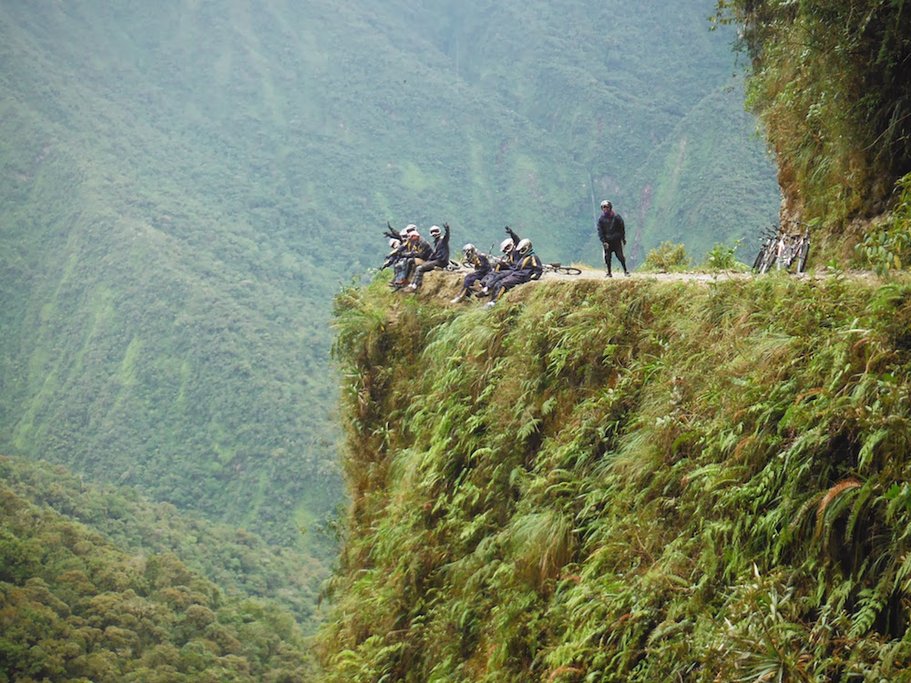 Bikers perched on the edge of Death Road.