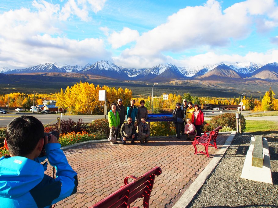 Visitors posing for a photo at the park's entrance