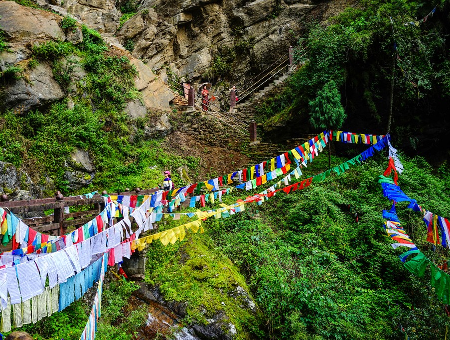 Prayer flags draping the hillsides of Bhutan