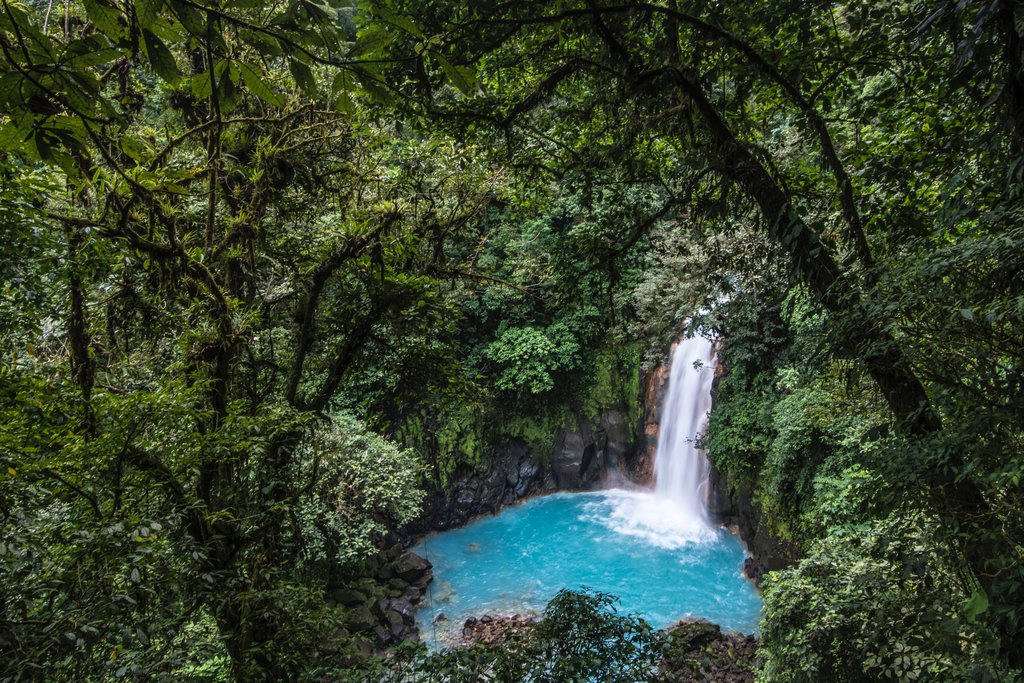 Take in the waterfall's incredible blue color