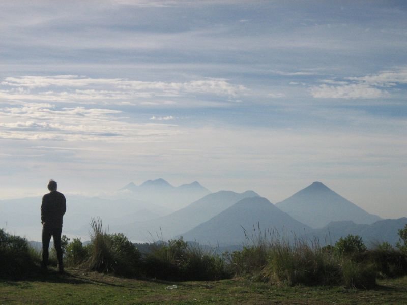 View from the Zunil campsite of string of volcanoes