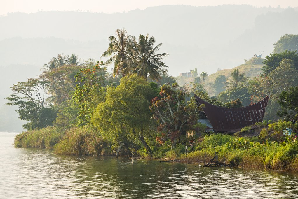 Go on a village tour around Samosir and see the unique Batak houses