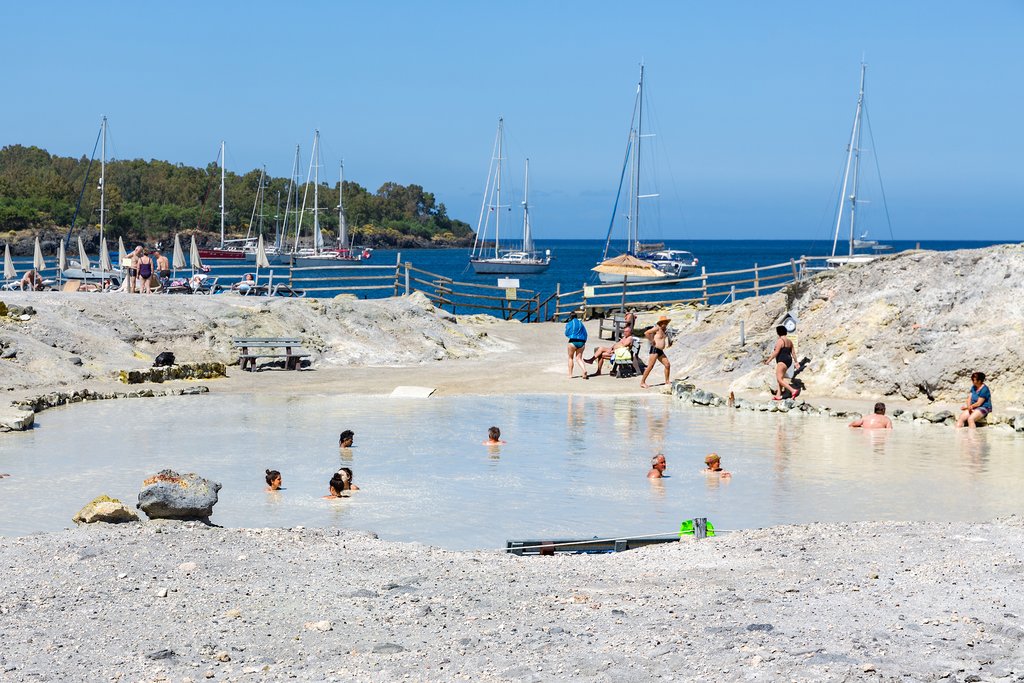 Italy - Sicly - Vulcano - People relax in a mud pool on Vulcano Island