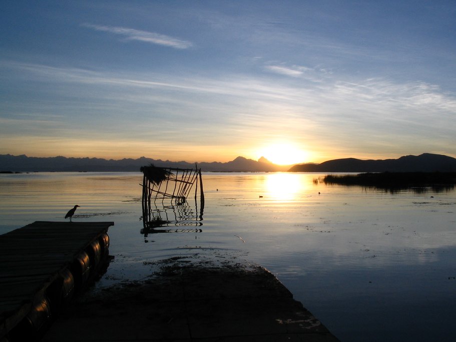 Sunset over the lake edged with reeds used for millennia to make fishing nets.