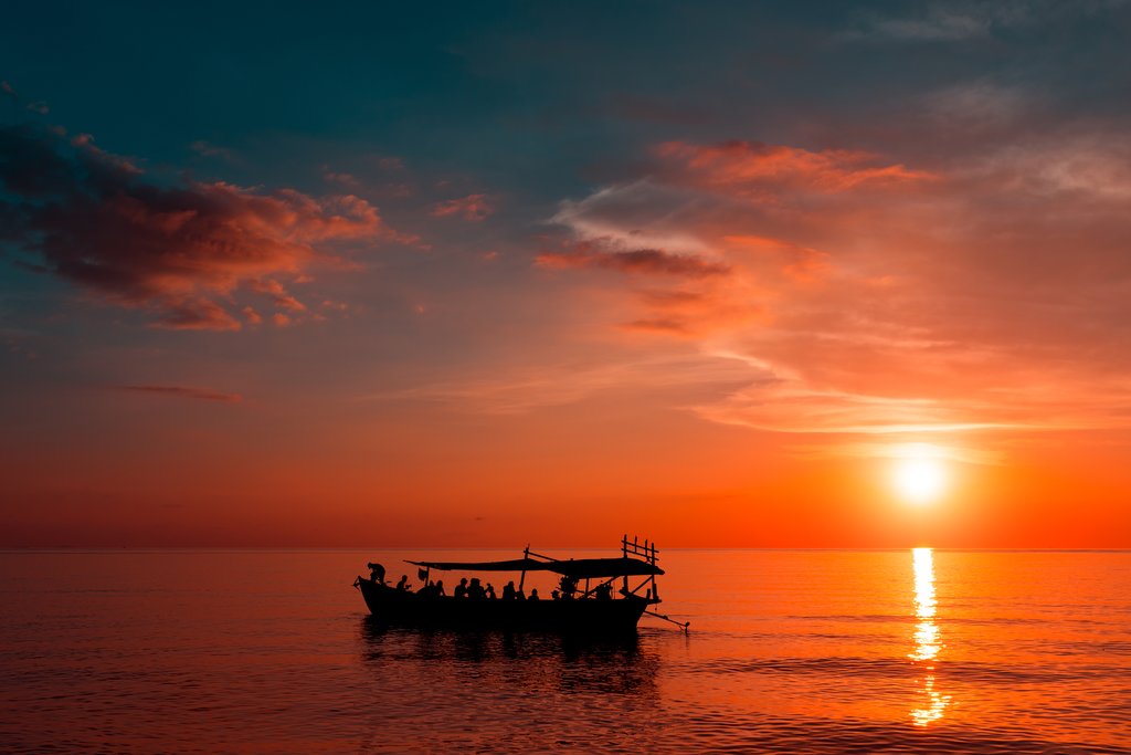 Take an optional boat trip around the island at sunset