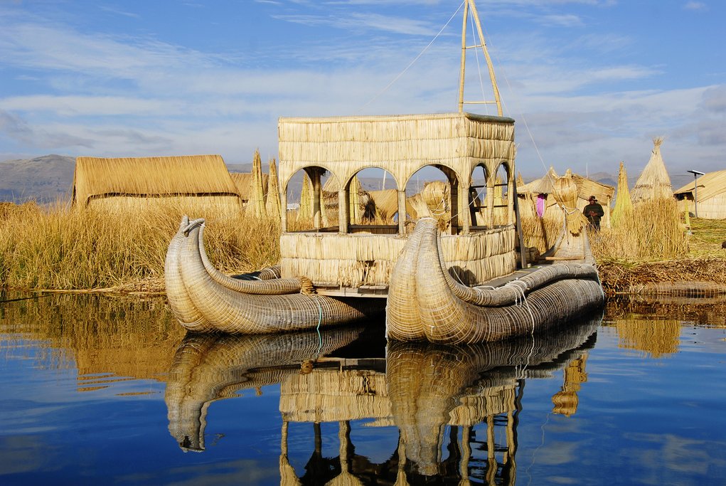 Floating houses and boats on Lake Titicaca