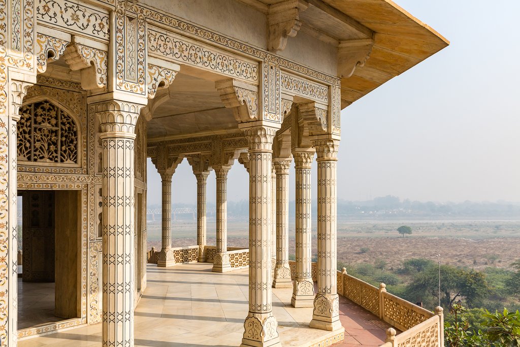 Visit Agra Fort at sunset for your first glimpse of the Taj Mahal!