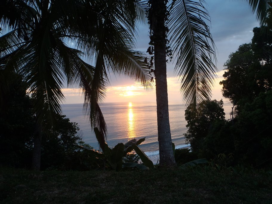 Take in the beautiful sunset over the ocean in Uvita