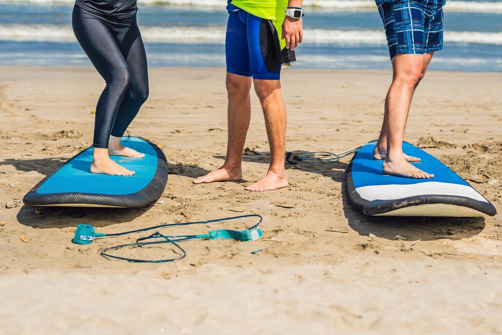 Meet your professional surf instructor for a day of catching waves