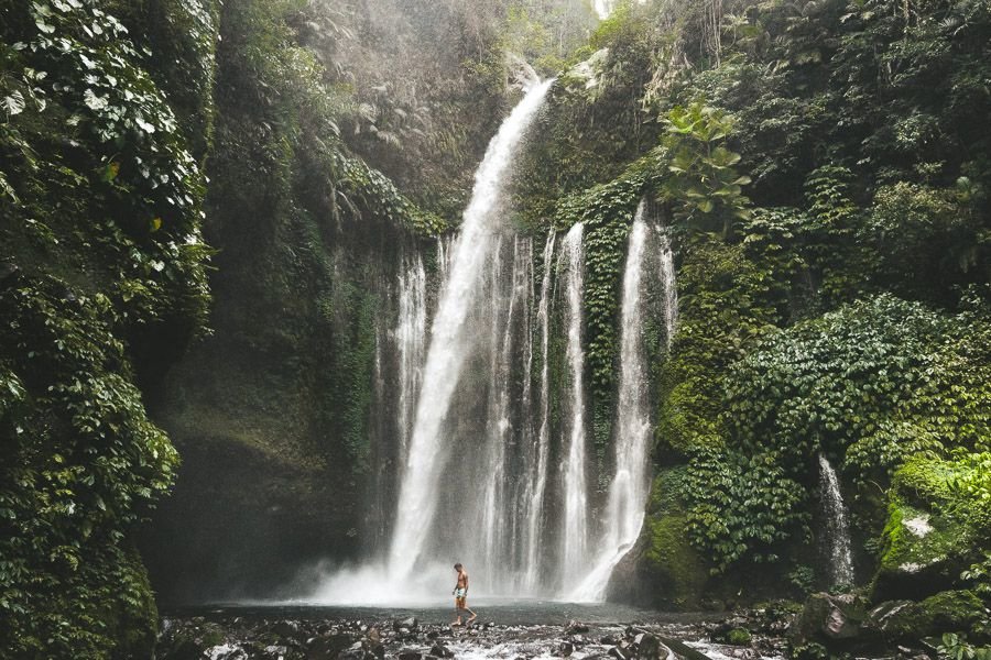 Cool off underthe Sendang Gile waterfall