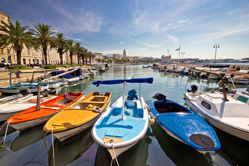 Colorful boats line a marina on Vineyards at Smokvica village on Korčula