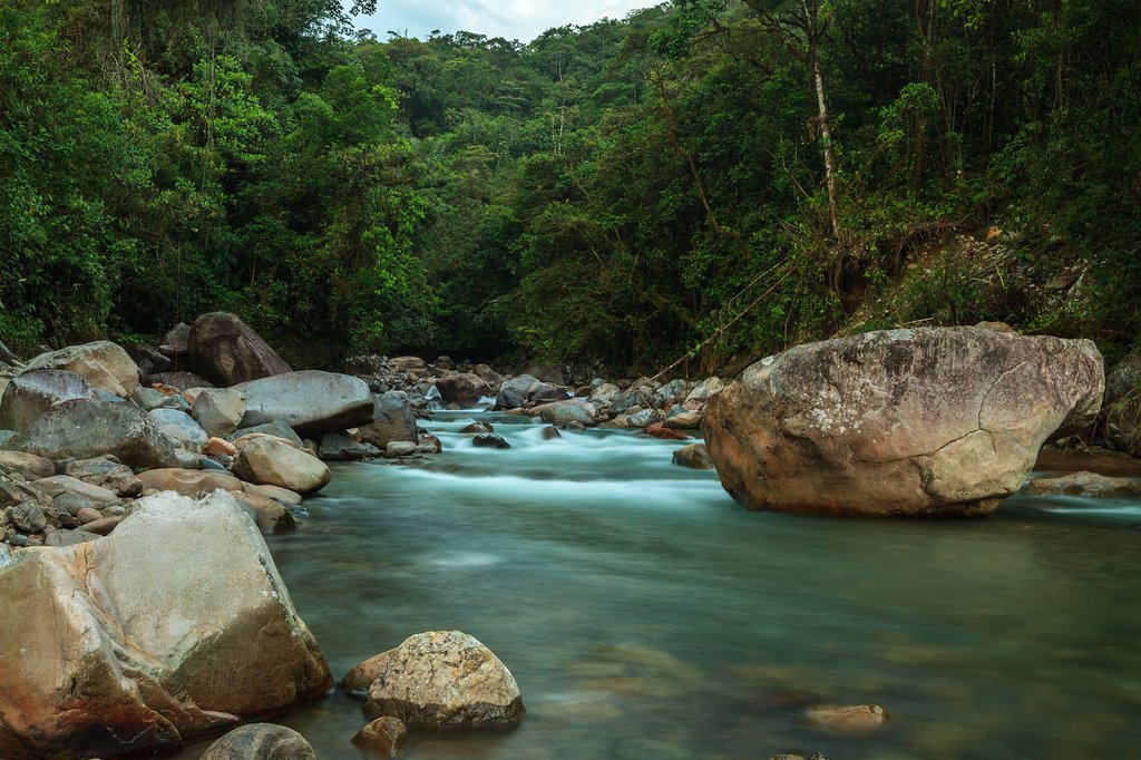 Condor Machay Waterfall spills out of the Ecuador highlands