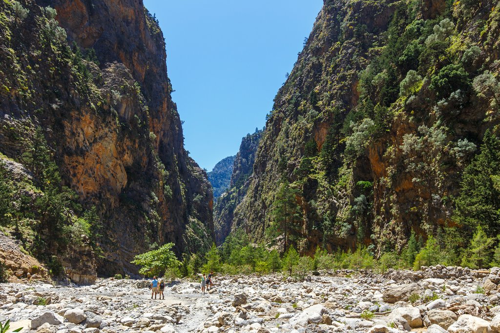 Under the towering rock faces