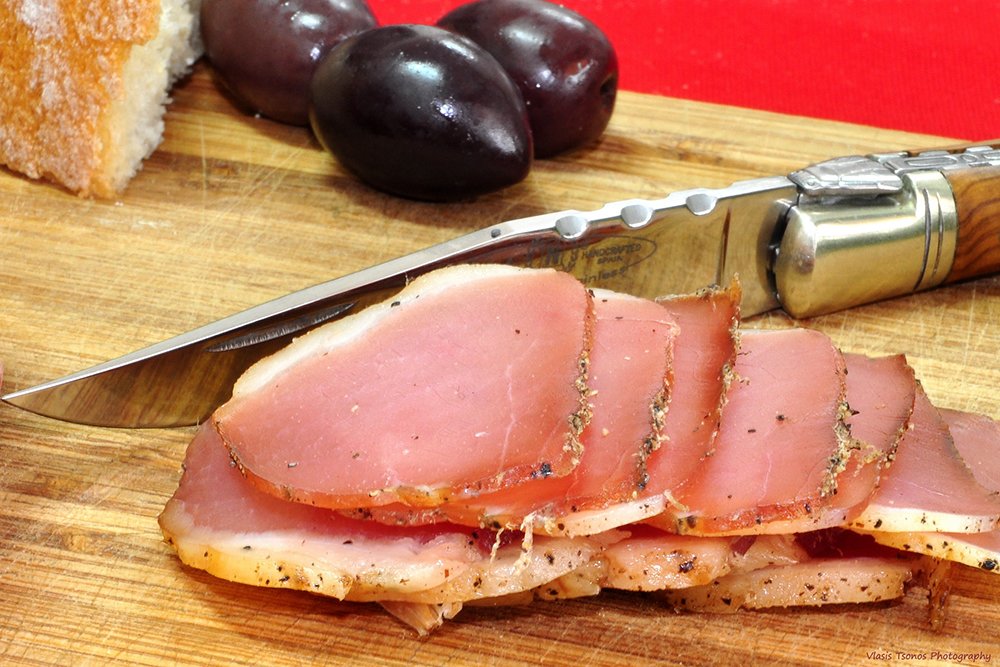 Cured meats and olives await