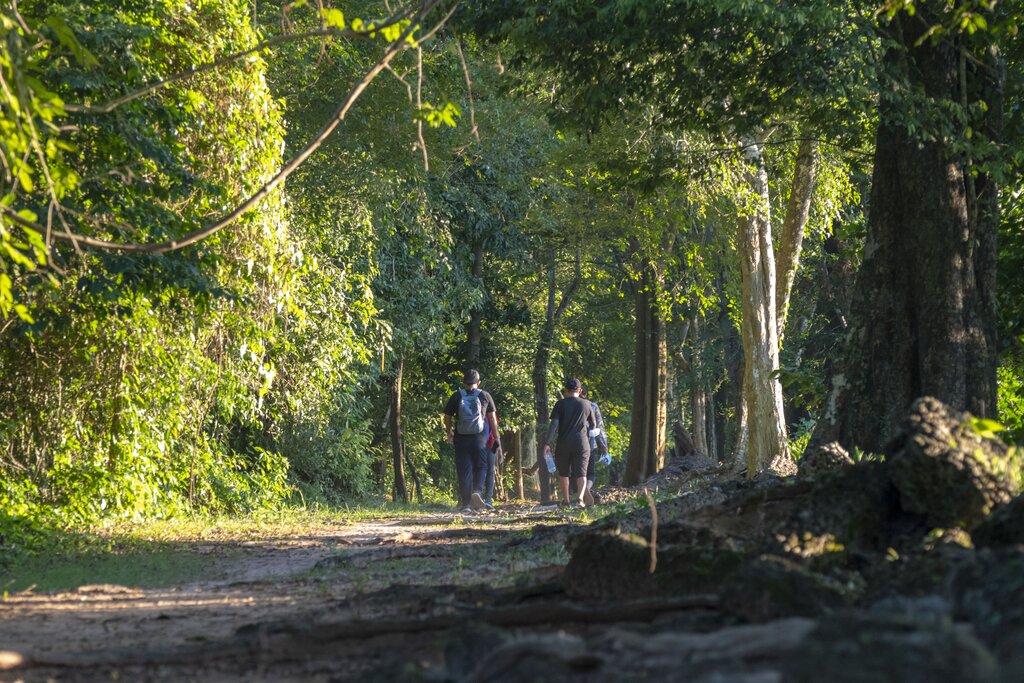 Trekking along Angkor Thom's walls