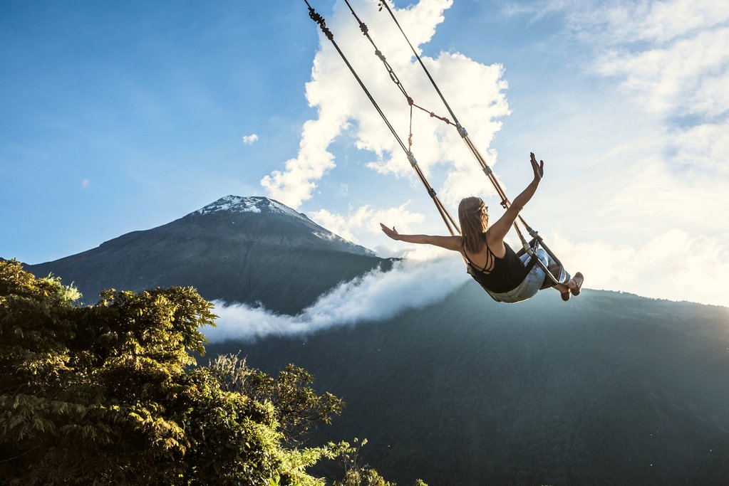 Swing at the end of the world in Baños, Ecuador