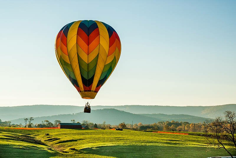 Hot air balloon in Tuscany countryside