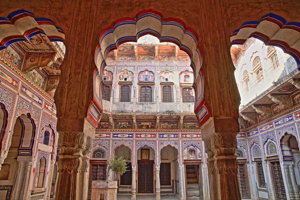 India - Shekhawati RAJASTHAN - Morarka Haveli with colorful frescoes and paintings and arcades in the foreground