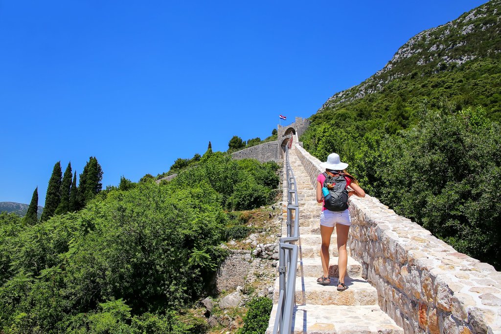 Climbing the parapet walkway of Ston's defensive wall