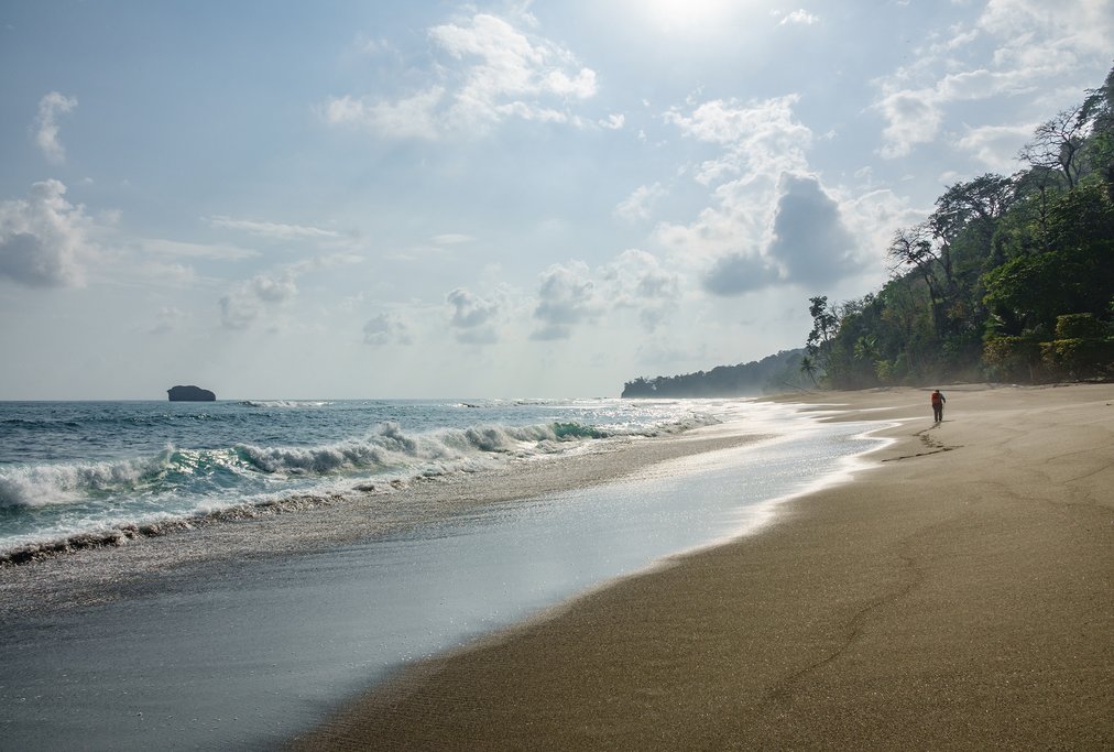 Take a sunrise beach walk before your flight