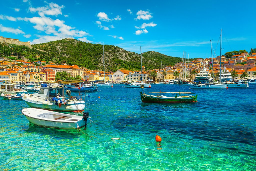 Boats moor along Hvar's coastline