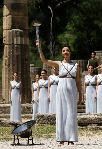 The fire is lit in Ancient Olympia and travels to the Beijing Olympic Games