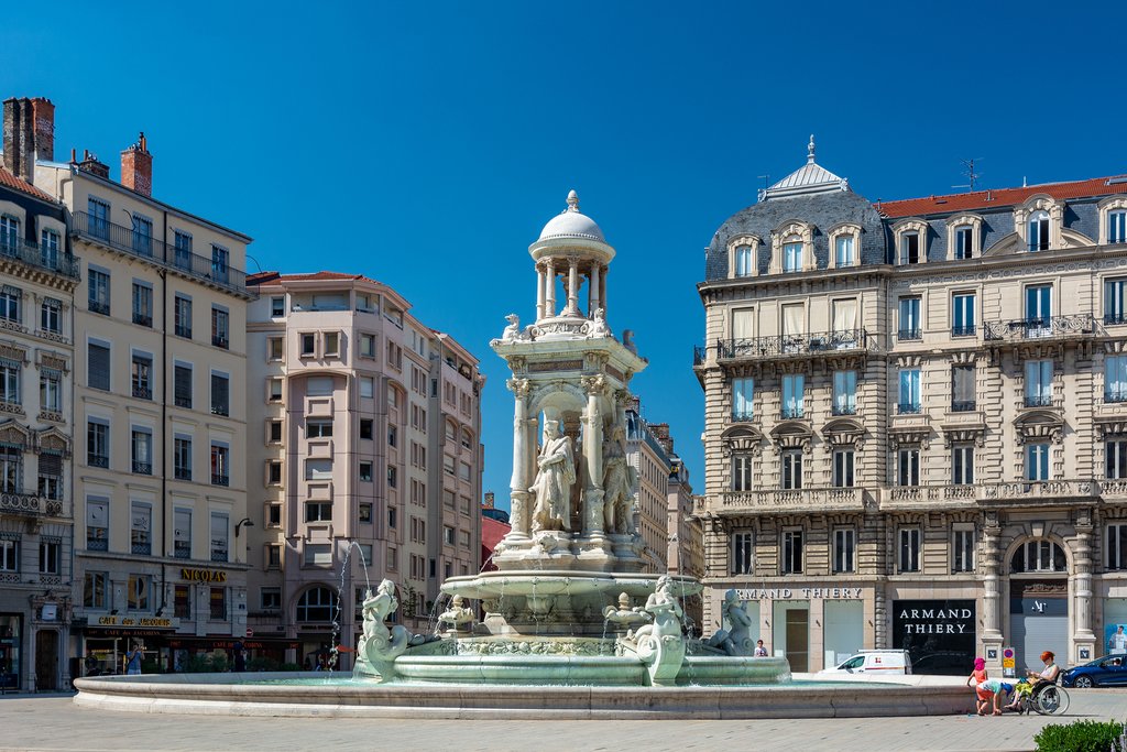 Tourists visiting the jacobins square in the vieux lyon district, France