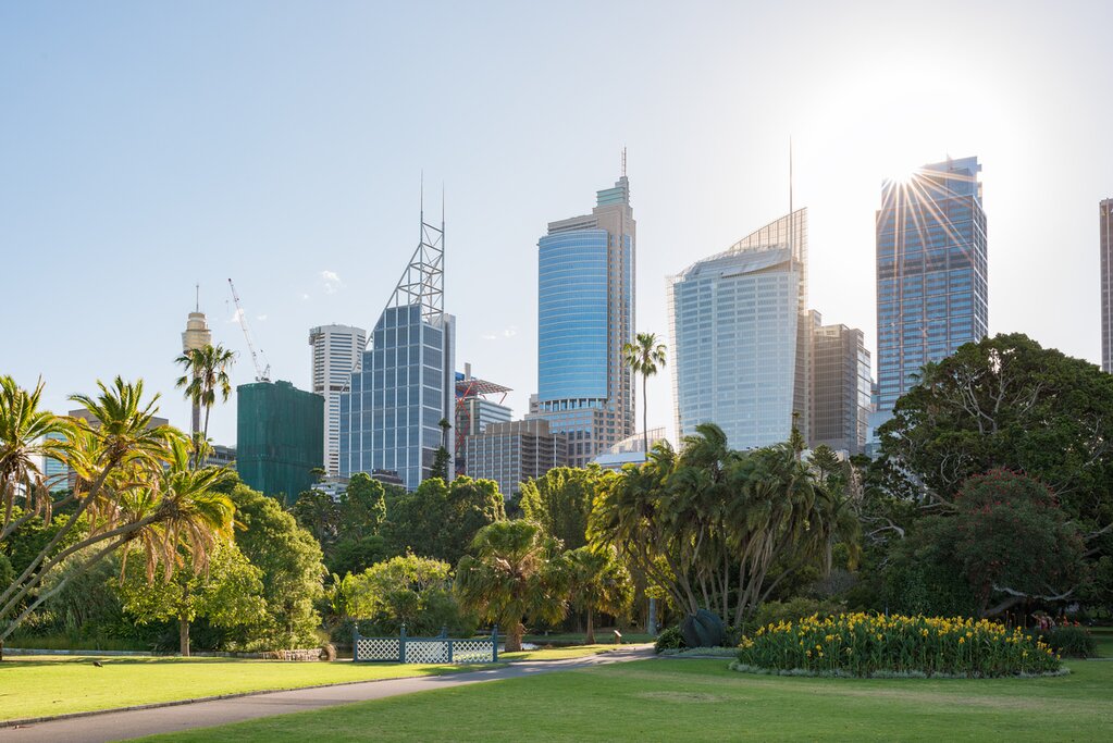 Cityscape with sun beam over the skyscraper and Botanic Garden