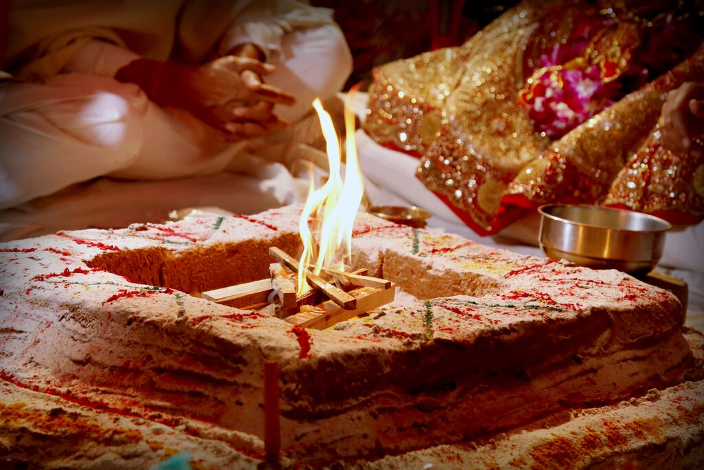 Attend an evening puja