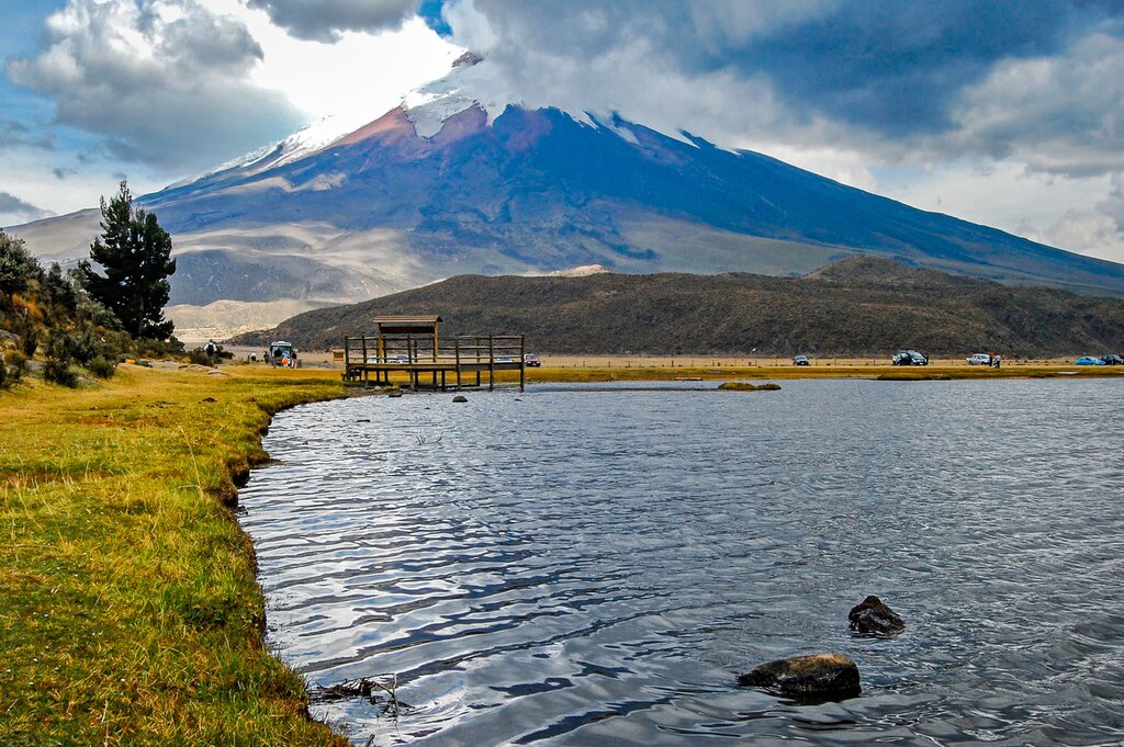 View of the Limpiopungo lagoon with the Cotopaxi volcano in the background on a cloudy and overcast afternoon