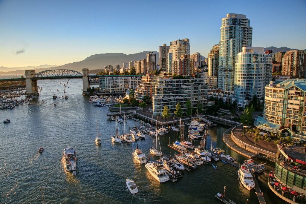 Admire the glittering Vancouver skyline, reflected in the Pacific Ocean