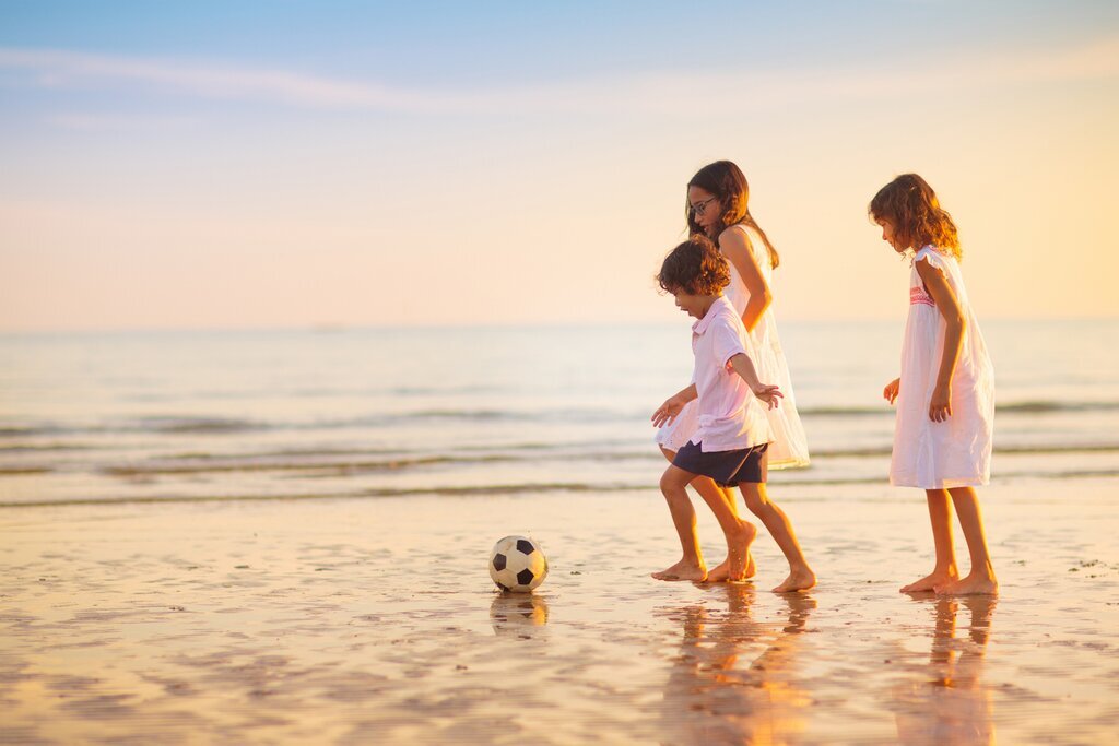 Watch the kids have a blast on Rio's white-sand beaches