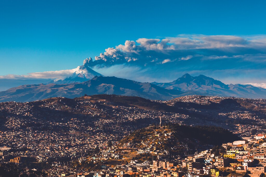 Aerial view of Quito and Cotopaxi Volcano in the daytime