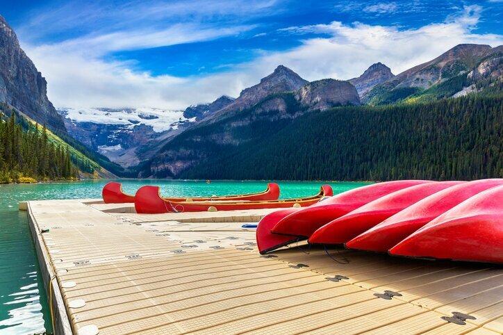 Canoes with a backdrop of the Canadian Rockies
