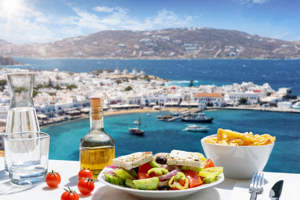 Enjoy delicious Greek food overlooking the Aegean Sea in Mykonos