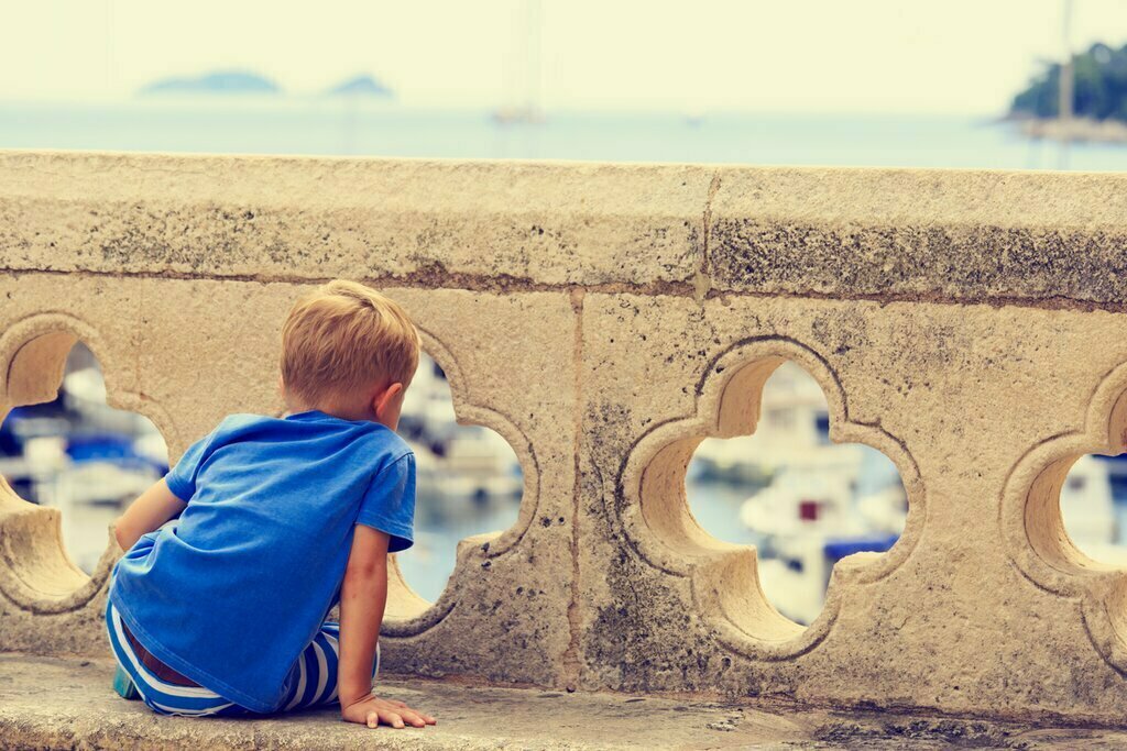 Young boy looking over Dubrovnik