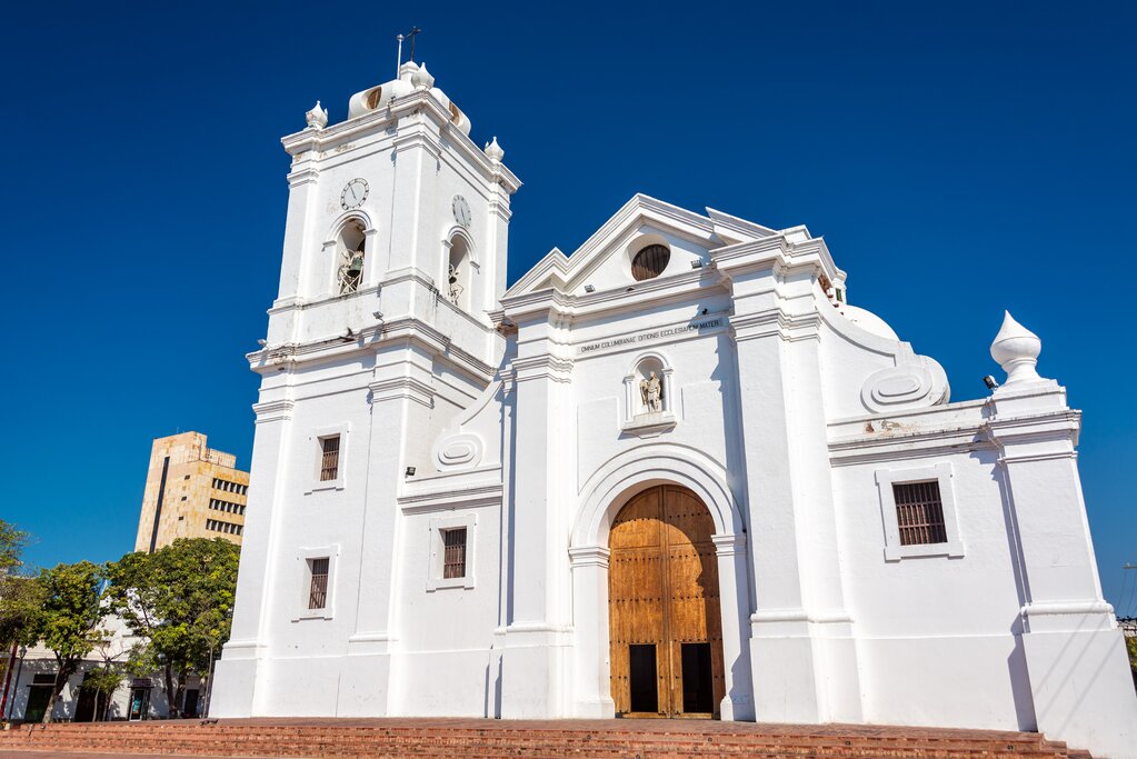 An old white cathedral against a blue sky