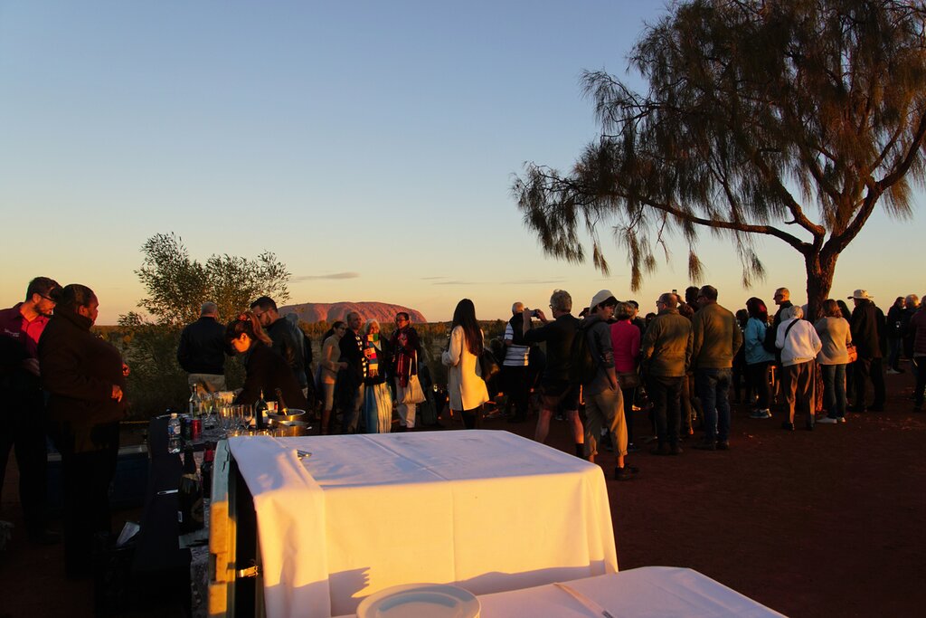 Watch the sunrise over Uluru and the Fields of Light