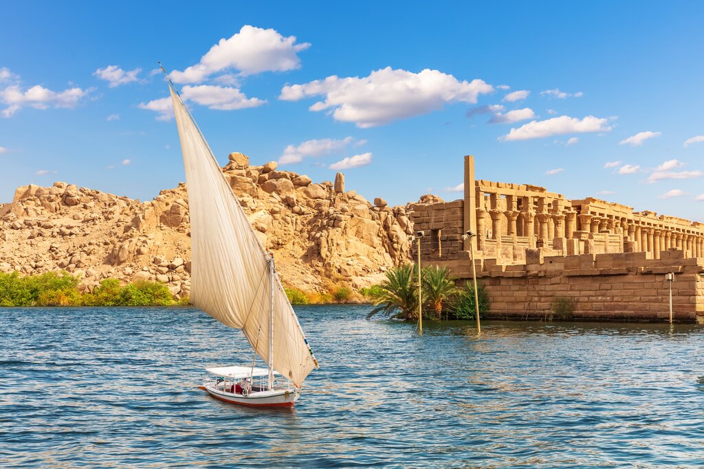 Spot Aswan's landmarks aboard a felucca, a traditional wooden sailboat