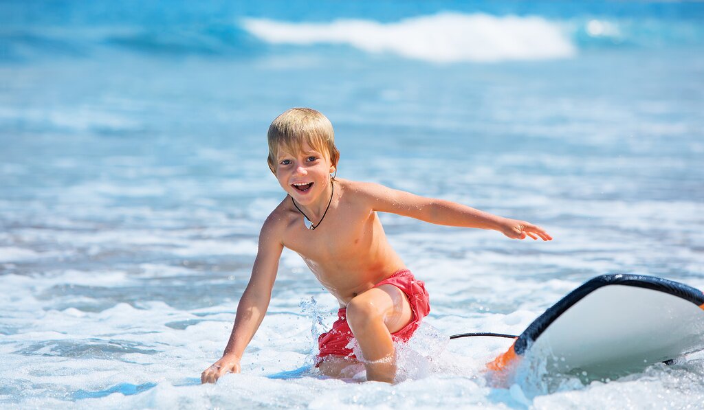 boy happy surfing