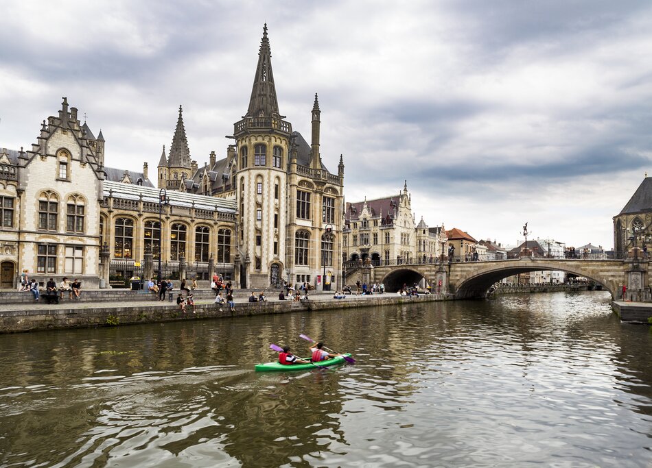 Kayak Leie (or Lys) river in Ghent. View at Graslei quay and Sint-Michielsplein (St Michael's Bridge)