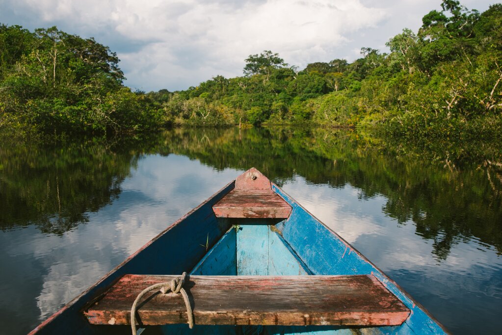 Canoe traveling through the Amazon
